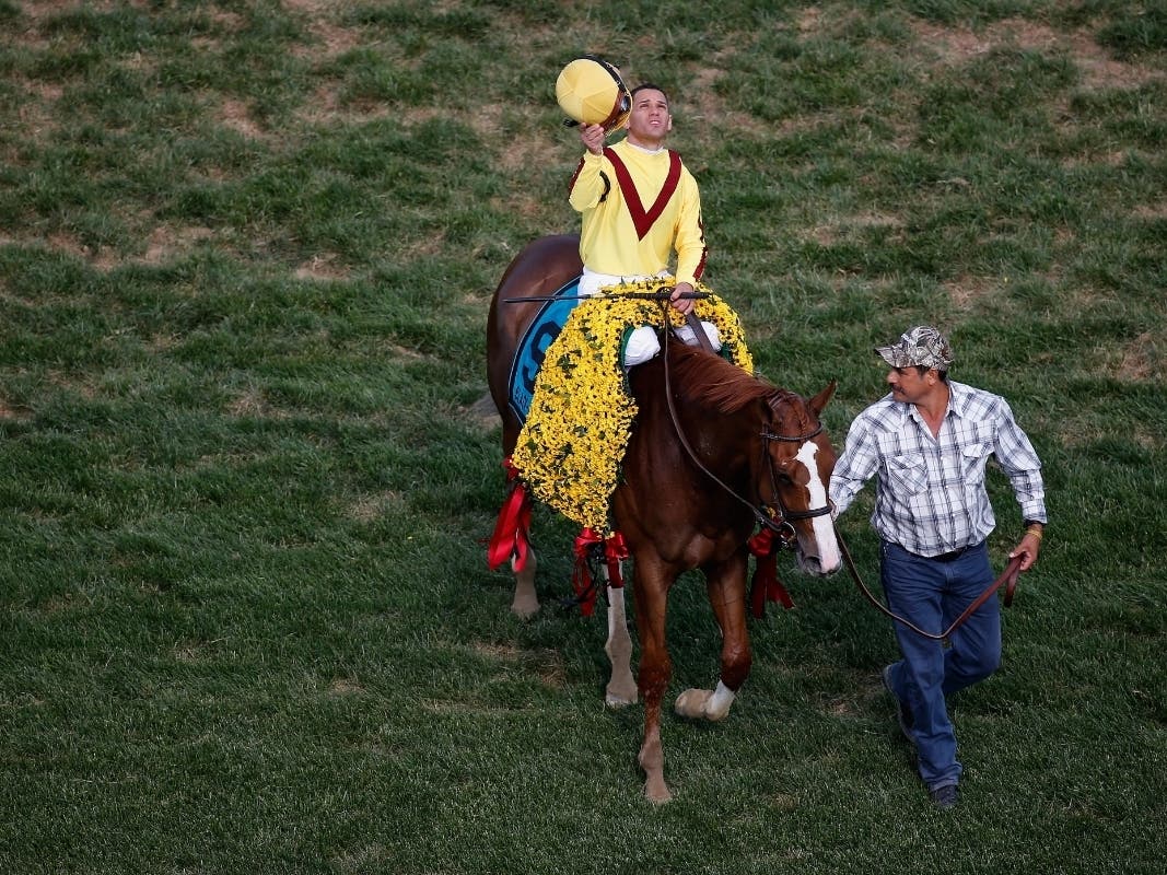 Jockey Javier Castellano celebrates with horse Keen Pauline #9 after winning the Black-Eyed Susan in 2015.