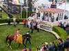Tyler Gaffalione rides War of Will into the winner's circle at the 144th Preakness Stakes at Pimlico.