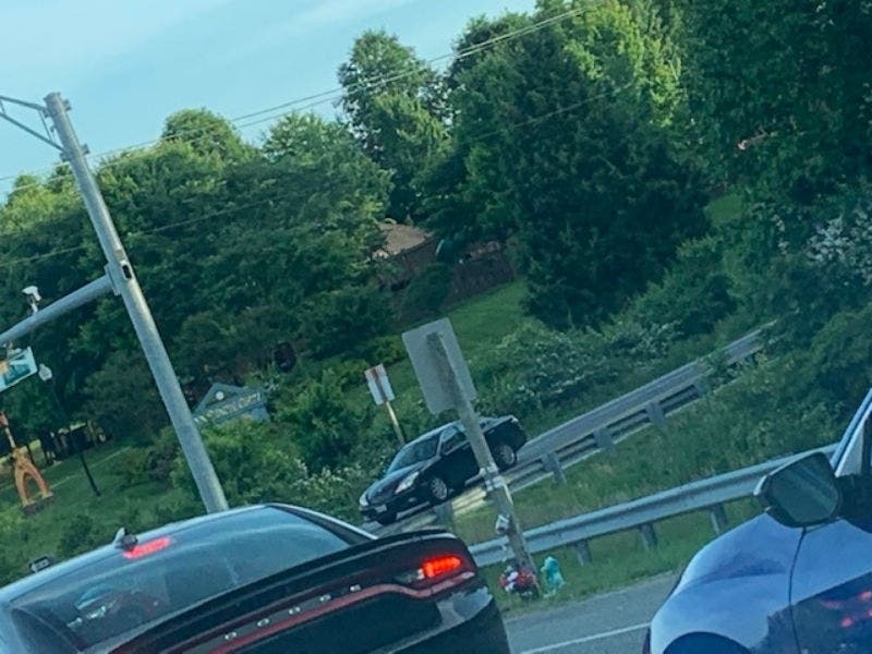 Balloons are tied around a sign near the intersection of MD 24 at Ring Factory Road.