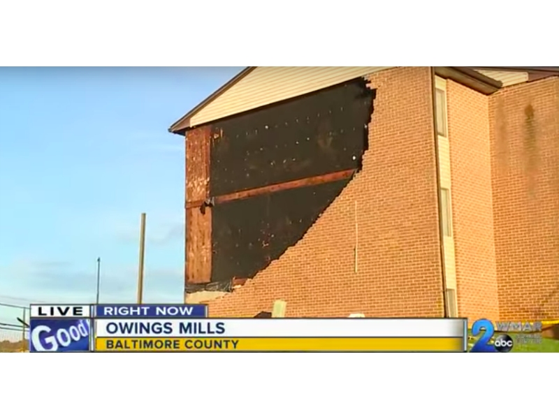 A hole is in the side of Foundry Centre Apartments, where a pile of bricks is now left where the wall used to be.