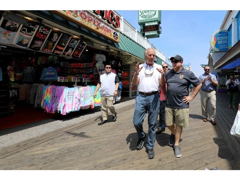 Comptroller Peter Franchot and Gov. Larry Hogan walk the Ocean City boardwalk.