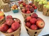 Apples are for sale. These baskets were priced at $9 each.