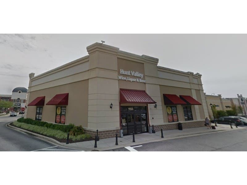 Officials said a Baltimore man threatened people inside a liquor store before cutting five people and being killed by police.