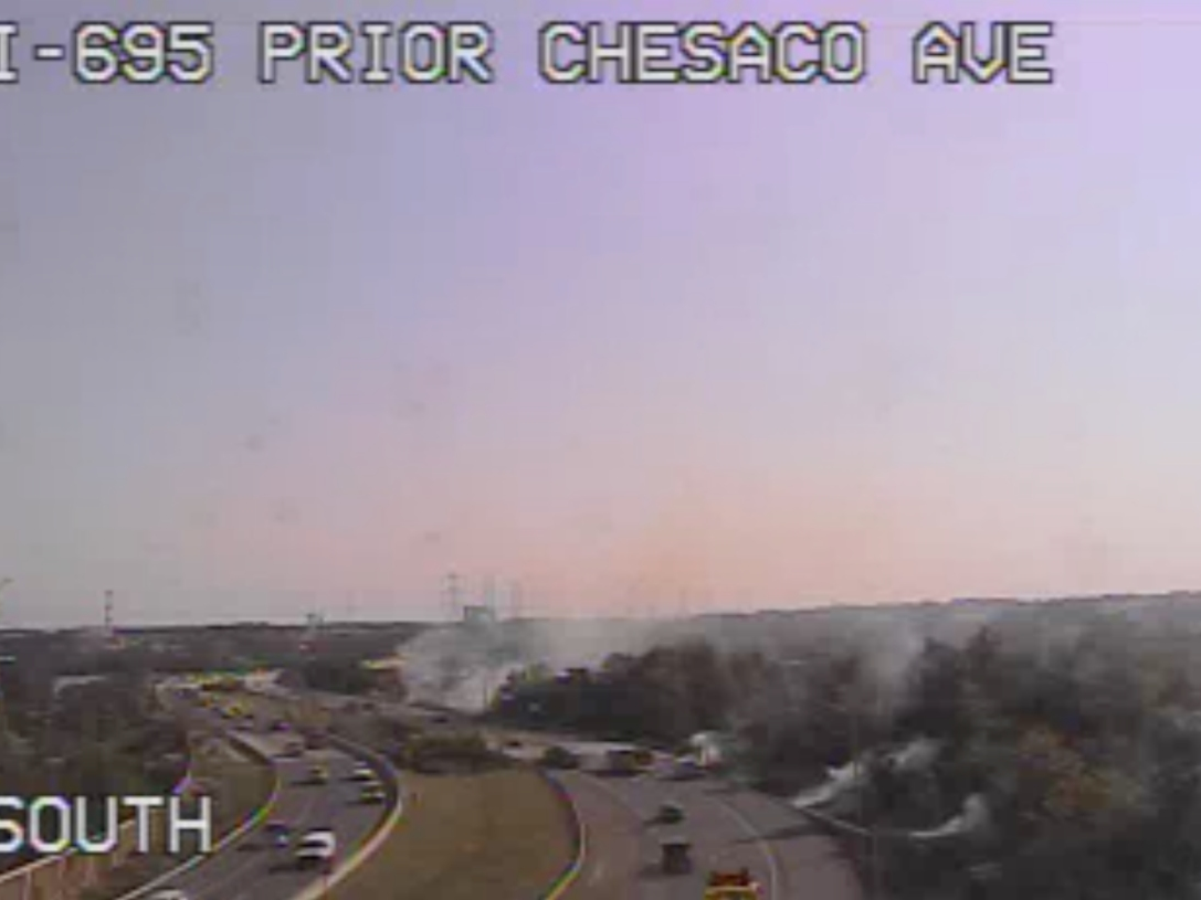 Brush fires were visible along the edge of Interstate 695.