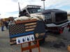 A truck for First Warrior, a company that sells patriotic apparel, stood in the parking lot among several other vehicles decked out in a show of support for police.