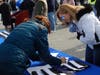 Harford County Citizens Police Academy alumna Silvia Meranski volunteered to help give away the thin blue line flags.