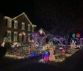 The light show at 8126 Quarterfield Farms Drive in Severn started as a decorated snowman and grew from there, according to its creator, who started the endeavor when he was a tween.