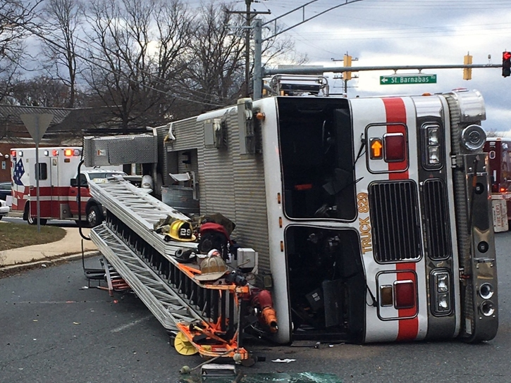 Six firefighters were on a truck in Prince George's County Sunday when it flipped over, officials said.