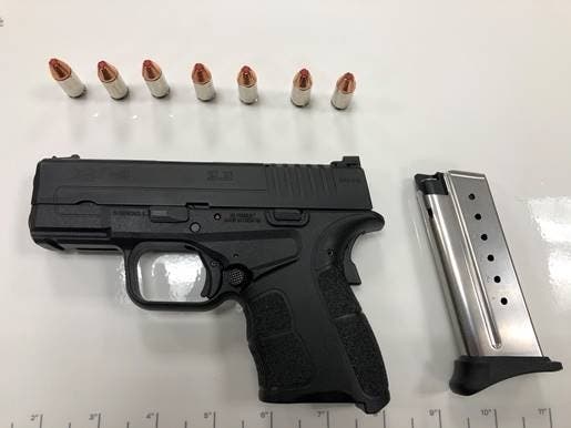 Authorities said a TSA agent spotted the Harford County man's gun, loaded with seven bullets, in the x-ray machine.