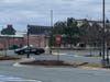 Police set up a perimeter behind the Bel Air Plaza shopping center.