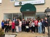 Cutting the ribbon at Bella Vita Salon was a group effort.