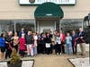 Cutting the ribbon at Bella Vita Salon was a group effort March 3 in Bel Air.