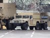 Maryland National Guard vehicles are staging at M&T Bank Stadium in Baltimore on Saturday, March 21.