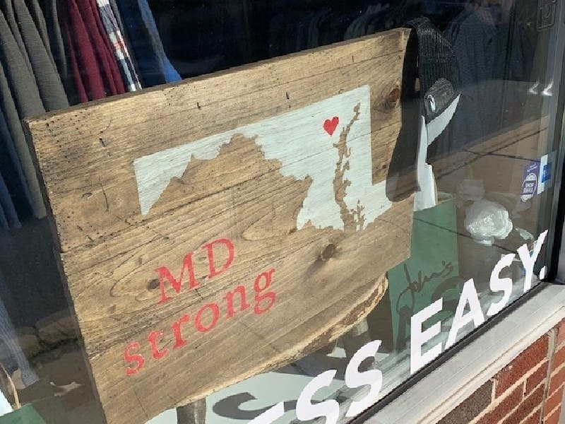 A sign sits in the window of John's Men's Clothing in Bel Air, made by Board and Brush of Forest Hill. These and other retailers could reopen in the first phase of the governor's three-step plan to reopen the state.