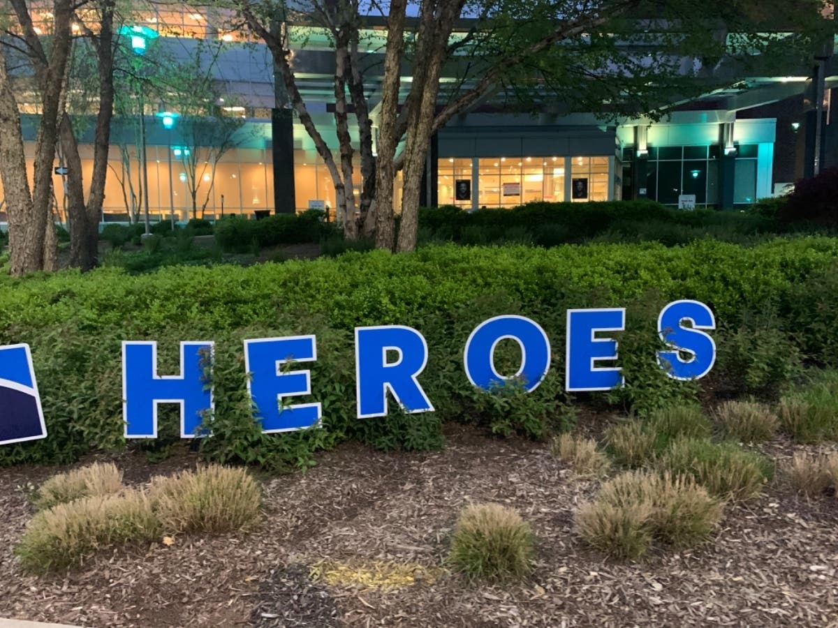 A sign outside Northwest Hospital in Randallstown says "Heroes Work Here # Care Bravely" to thank staff at the health care center.