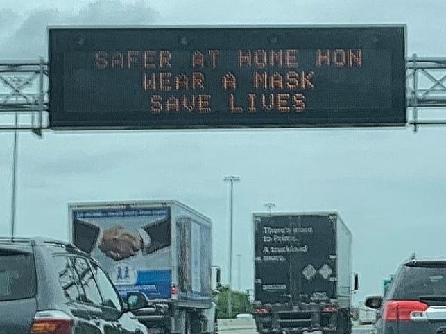 Signage on Interstate 95 in Baltimore reinforces messaging that state and local officials have issued about staying home and waring a mask to prevent the coronavirus from spreading.