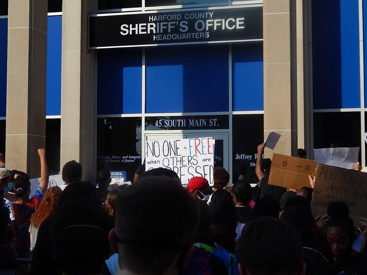 Demonstrators held signs condemning oppression and racism at a rally for black lives outside the Harford County Sheriff's Office on Main Street in Bel Air Thursday, June 4.