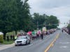 Protesters march along Reisterstown Road.