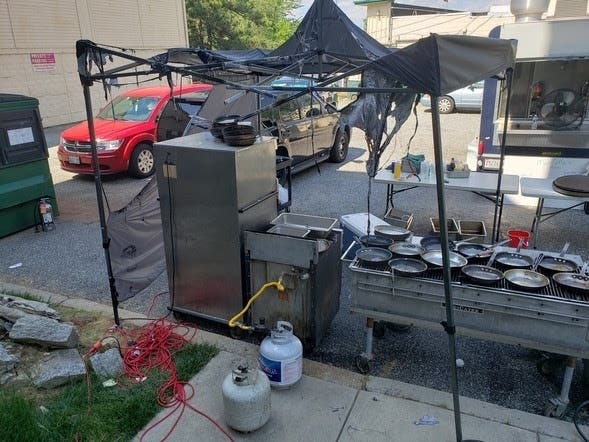 About 20 firefighters were called to MacGregor's Friday after a grilling incident, the fire marshal said.