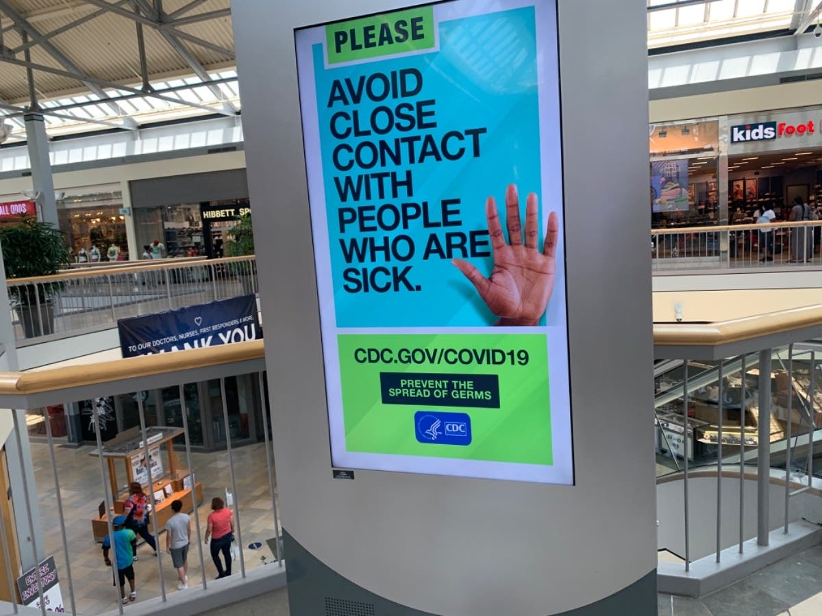 Digital message boards in White Marsh Mall reinforce public health guidance from the Centers for Disease Control and Prevention to prevent the spread of the coronavirus. As the state reopens, officials say metrics show the virus is slowing.