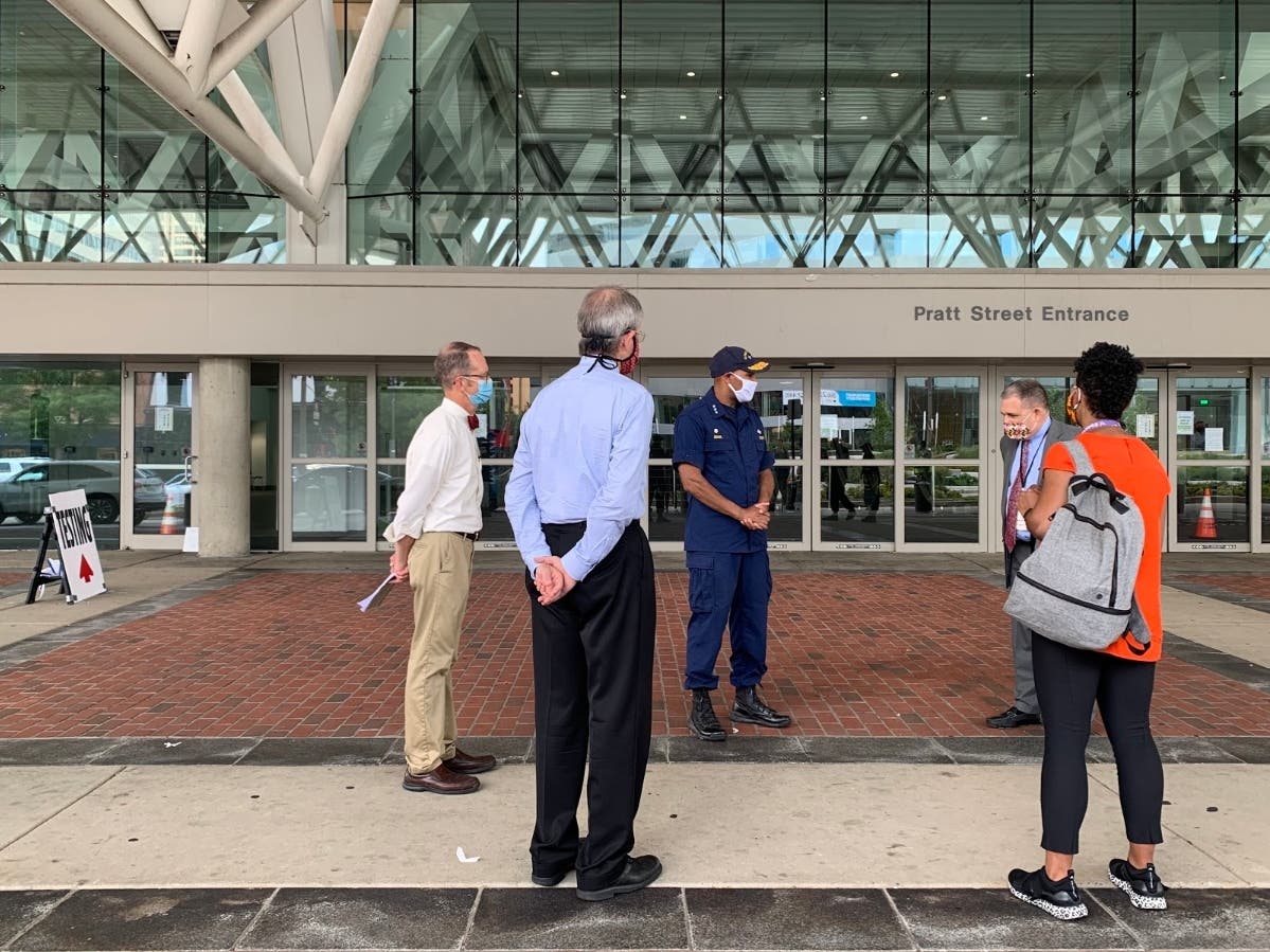 U.S. Surgeon General Dr. Jerome Adams met with local leaders about the coronavirus testing center and field hospital at the Baltimore Convention Center on Pratt Street.