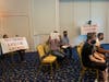 Several protesters held signs on one side of the room at Waters Edge in Belcamp, where the liquor board hearing was held Wednesday, Aug. 26.