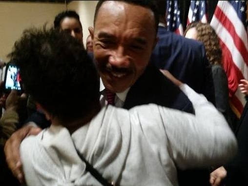 Kweisi Mfume hugs a supporter after winning the special Democratic congressional primary Feb. 5.