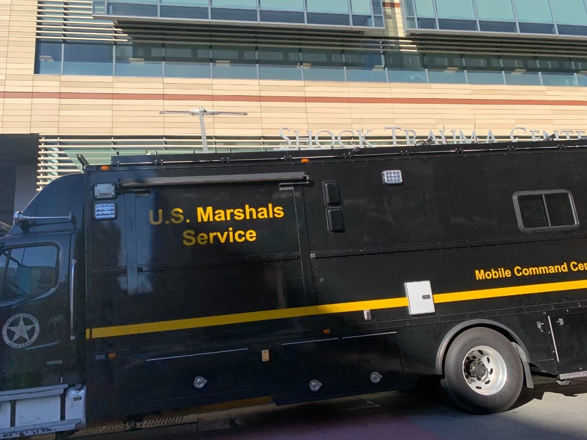 The U.S. Marshals mobile command center was parked outside the University of Maryland R Adams Cowley Shock Trauma Center Thursday, Feb. 4. A deputy marshal underwent surgery after being shot serving a warrant Thursday morning, officials said.