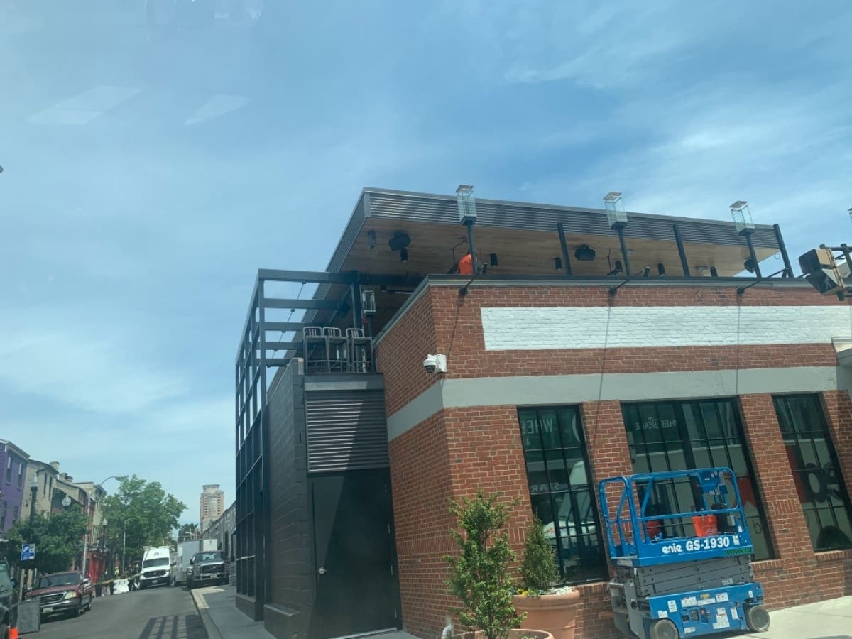 Outdoor dining is offered above Cross Street Market.