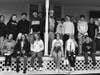 Group of Ellington High School students on back porch of Nellie McKnight Museum