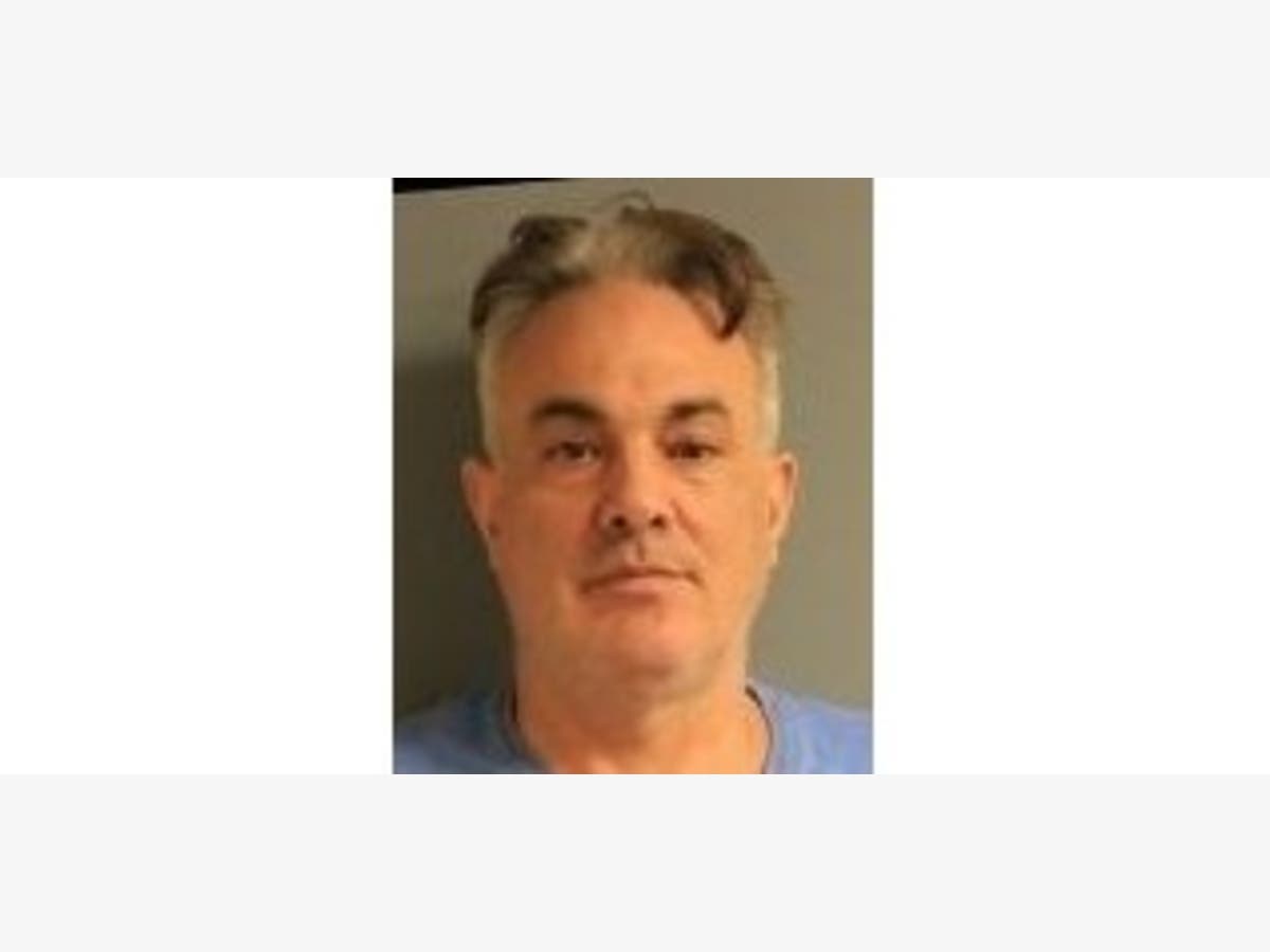 Dominick Volino, 53, was taken into custody as he was trying to board a flight out of the country.