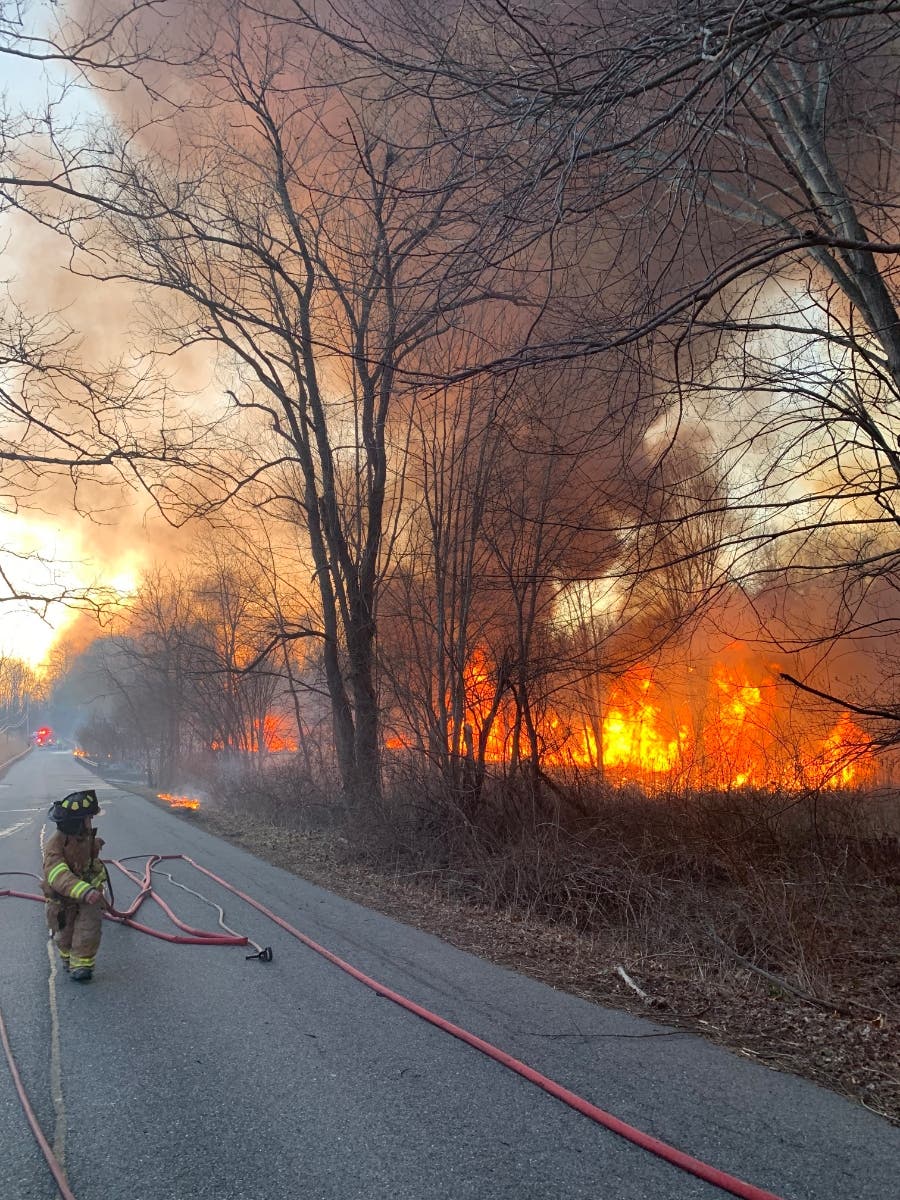 A firefighter on the scene of an aggressive brush fire in Goldens Bridge Wednesday.