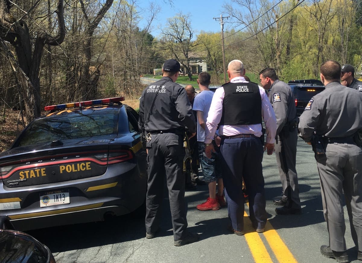 Dennis P. Ducharme, 28, of Pittsfield, Massachusetts, being taken into custody in Columbia County.