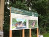 A sign explaining the improvements for the new welcome center.