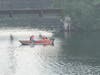 Members of the Golden's Bridge Fire Department pull an "exhausted" swimmer safely into their rescue boat.