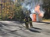 Golden's Bridge Fire Department members prepare to attack flames during a dramatic live burn demonstration at the third annual Community Day at the Firehouse. 