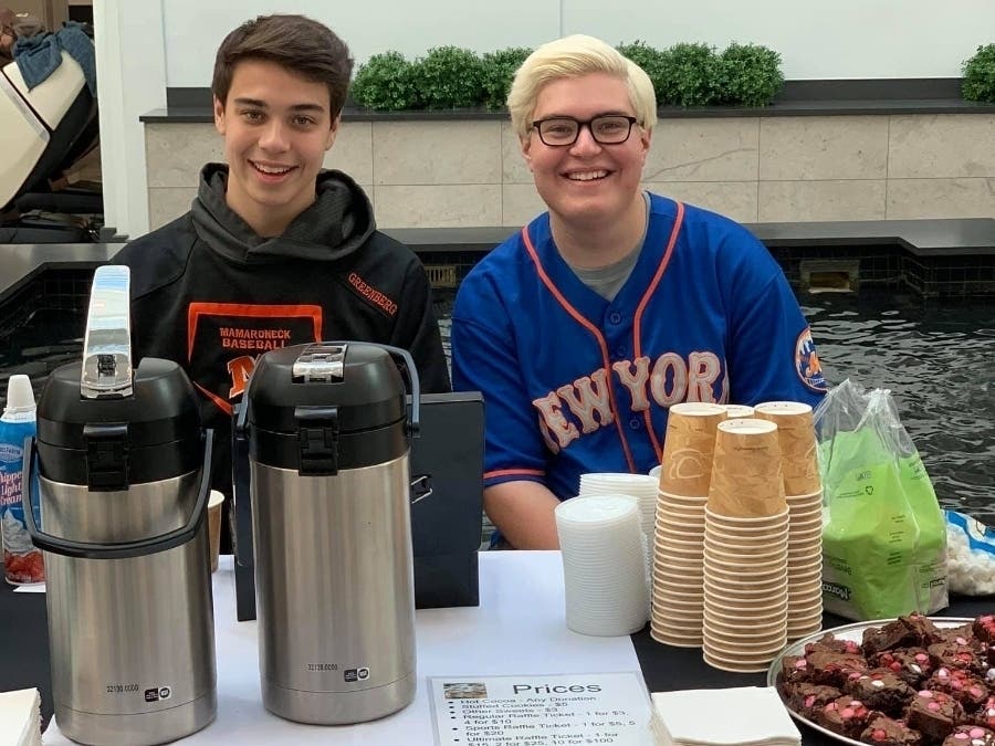 From left, Joshua and Evan Greenberg raising donations for Pediatric Cancer Foundation last year.