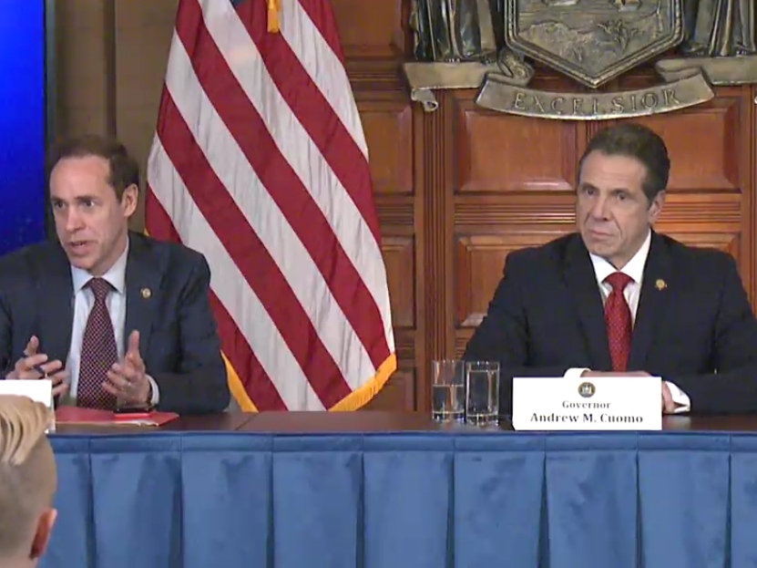 Health Commissioner Howard Zucker, left, and Gov. Andrew Cuomo talk about additional cases of coronavirus in New York at a news conference Wednesday, March 4, in Albany.