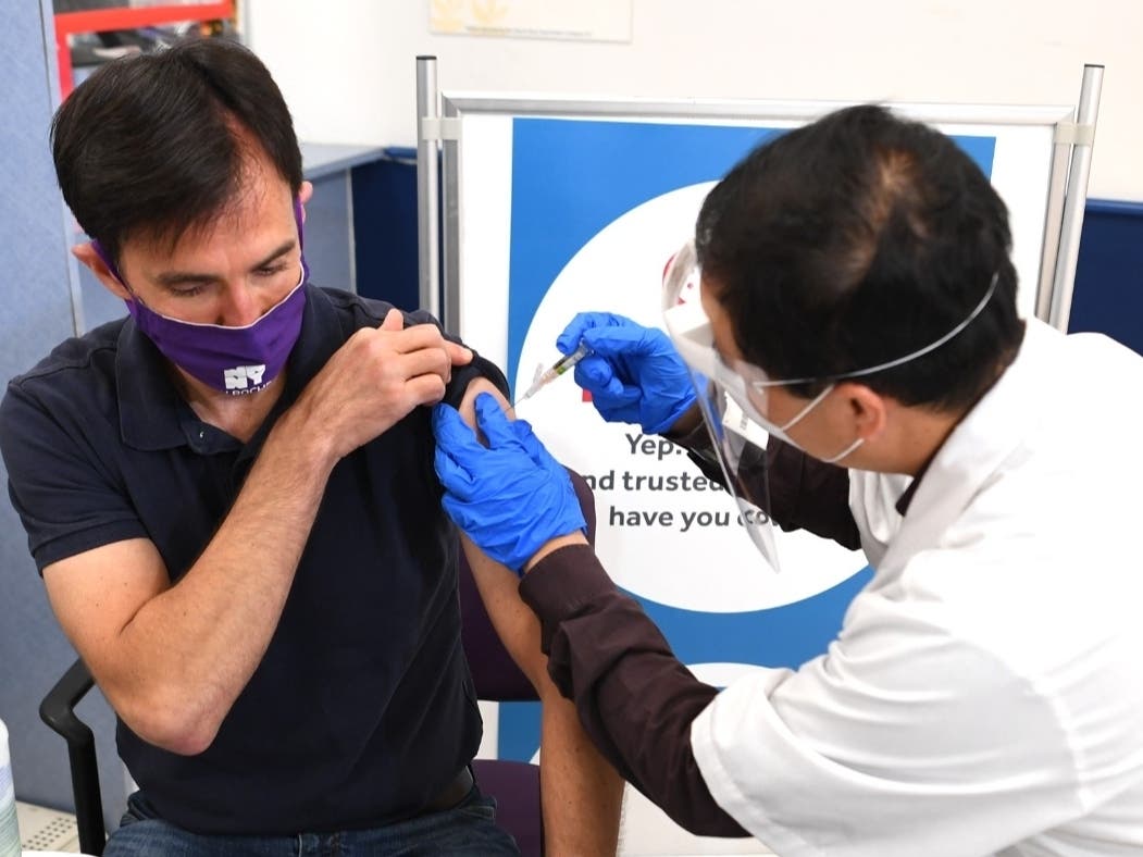 New Rochelle Mayor Noam Bramson receives his flu shot from Stop & Shop Pharmacist Chi Auyeung.
