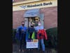 At Rhinebeck Savings Bank in Goshen, Michael Peters (l), Resource Exchange Coordinator for Catholic Charities of Orange, Sullivan and Ulster, accepted the donation of coats from Goshen club member Amy Van Amburgh (c) and Club President Mark Gargiulo.