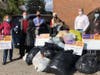 Warwick's Rotary Club collected 200 winter coats for Catholic Charities. Club members (l-r) Joyce Perron, Ed Lynch, Club President, Leo Kaytes, and Neil Sinclair helped Michael Peters and Kerri Foley (center) of Catholic Charities load up the donation.