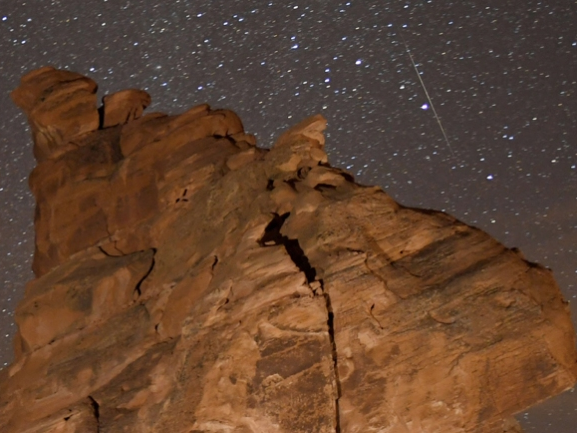 A Geminid meteor streaks across one of the peaks of the Seven Sisters rock formation in Nevada's Valley of Fire State Park in 2018. For the best chances to see the shower in the Hudson Valley, head to an area with dark sky.