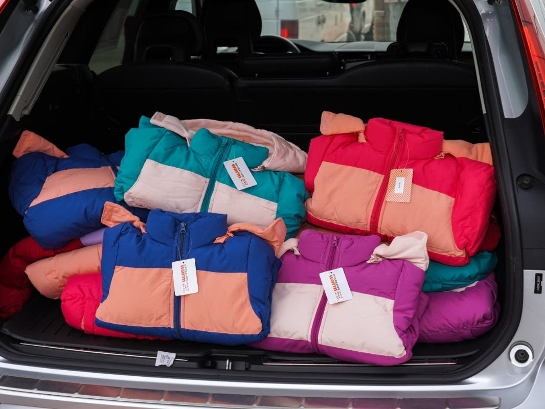Brand new winter coats donated by Premier Collection auto group, a member of the Greater New York Automobile Dealers Association, at Volvo Cars of White Plains, loaded for delivery to children in need throughout Westchester County.