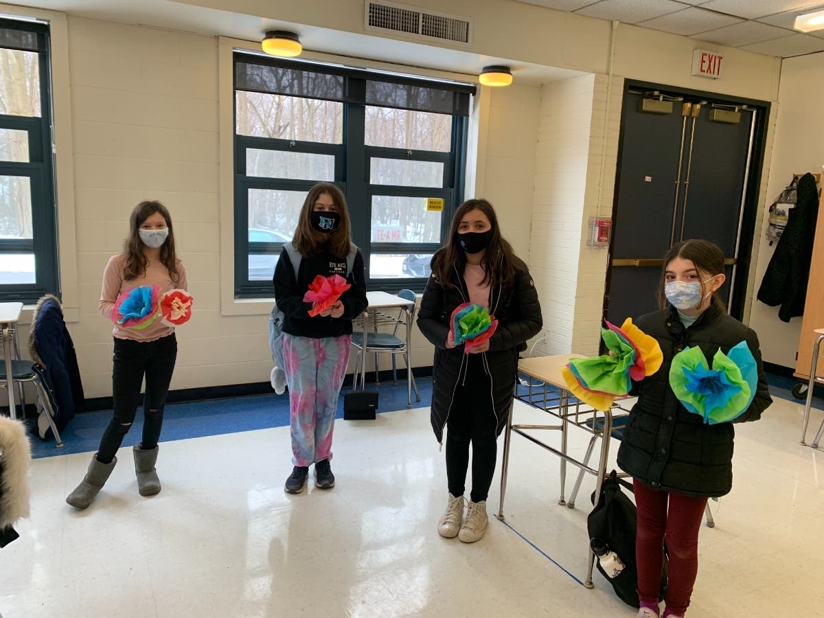 Rye Neck Middle School sixth-graders made paper tissue flowers, which they delivered to first responders at the Westchester County Convention Center on Valentine’s Day.