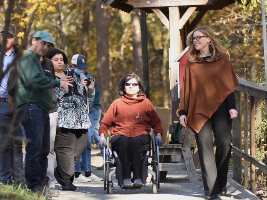 A group tours the newly restored and reopened Woodland Trail at Stony Kill Farm.