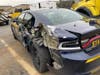 A box truck struck a New York State Police patrol car while it was parked on the shoulder of I-87.