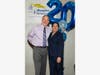 Joe Pizzo of Joseph Studios congratulates Rifath Khan, CEO, The Douglas Center.