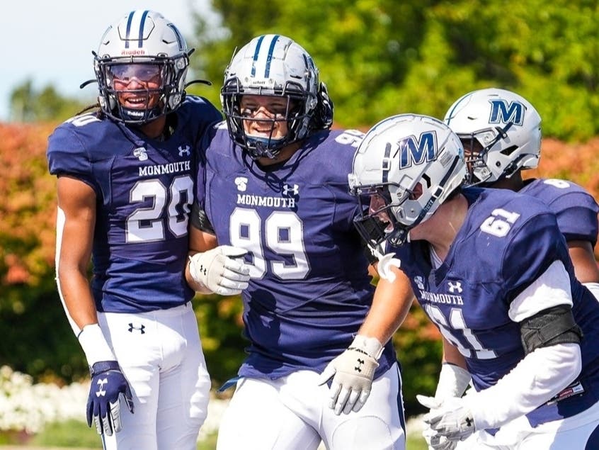 Hawks celebrate Nick Shoemaker's (99) defensive touchdown