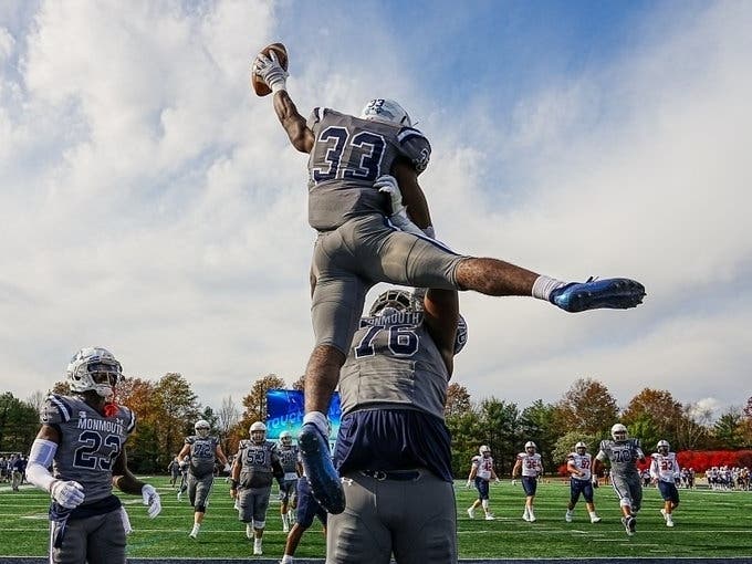 Monmouth's Jaden Shirden celebrates after his 75-yard touchdown run