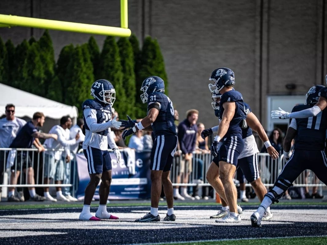 Hawks celebrate #31 Amori McNeil's pick six